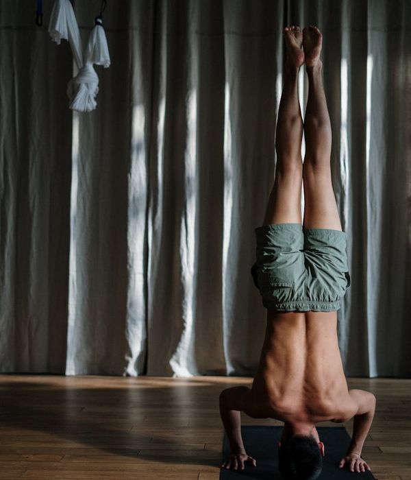 Man performing a core strength exercise in a calm environment.